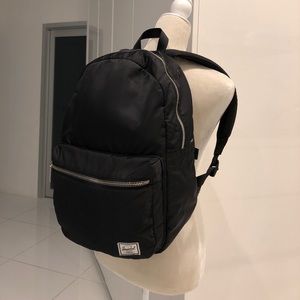 black backpack with silver zippers